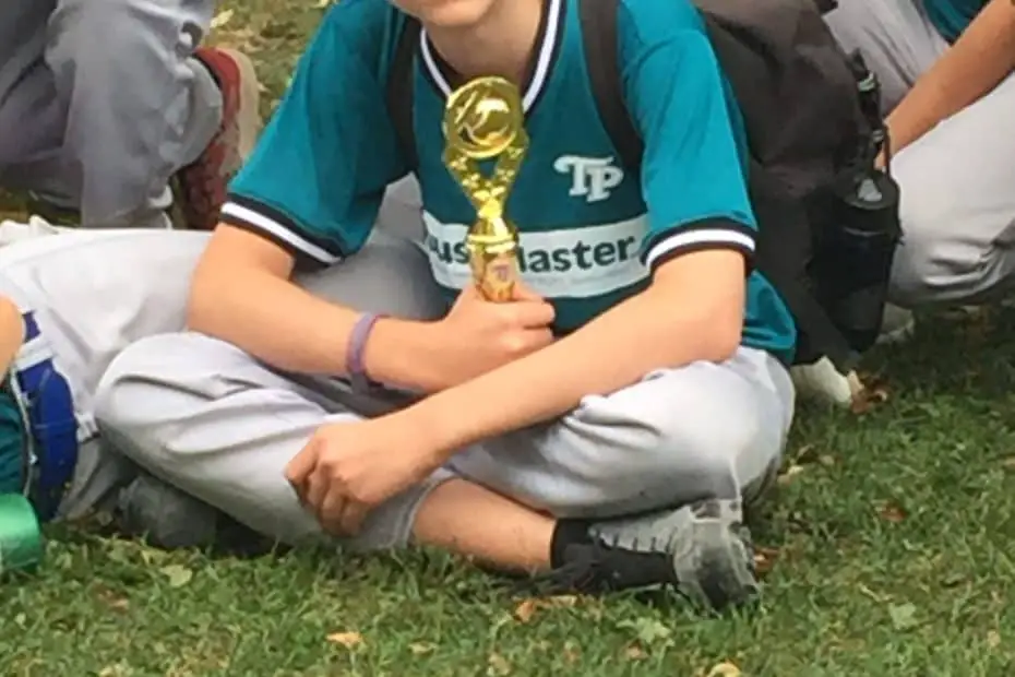 Baseball player with trophy