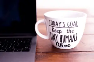 Mug with writing, "today's goal keep the tiny humans alive"