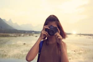 Young woman taking photo on vacation