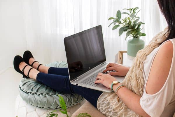 Woman typing on laptop